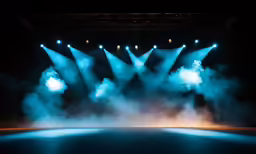 fog rolls over the stage with spotlights