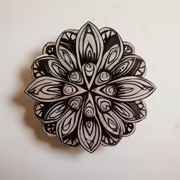 a paper sculpture of a flower on the wall