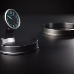 a watch sitting on top of a table next to a bracelet