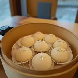 five baked desserts are in the wooden container