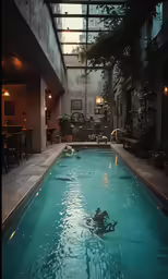 an indoor swimming pool in a large building