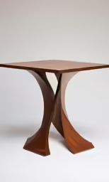 a wooden table with a curved base