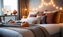 a hotel room with fruit laying on a bed