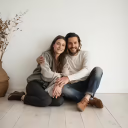 a man and woman are posing for a photo