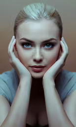 a woman with blond hair is posing for the camera