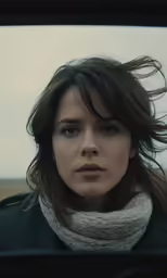 the woman is staring into the distance