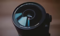 a lens is attached to the end of the camera