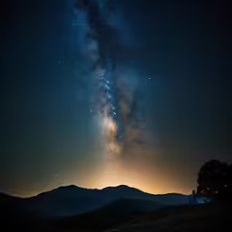 a night time photo with the milky in the background
