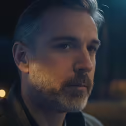 a close up of a person with a goatee