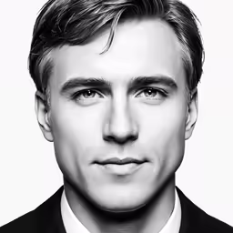 the man is wearing a suit and tie