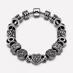 silver plated heart charm bracelet on a white background,an antique style bracelet with black and silver beads