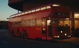an image of a double decker bus at dusk