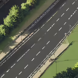 an aerial view of highway traffic and pedestrian tracks