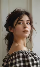 a young asian girl wearing a checkered top