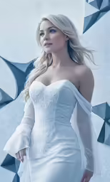 a woman standing wearing a white dress