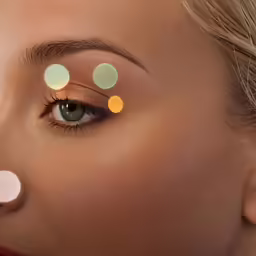 a woman with a closeup on her eyes has many colored circles in front of her eye