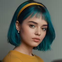 a girl with bright blue hair, wearing a mustard sweater and black hair