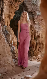 there is a woman wearing a purple dress