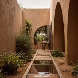 a small outdoor pool next to a building