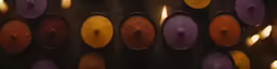 colorful candles are seen in different sizes and colors