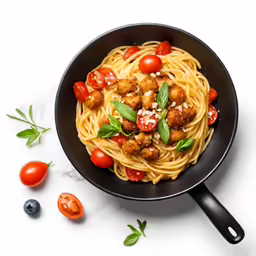 a bowl filled with spaghetti and vegetables next to tomato