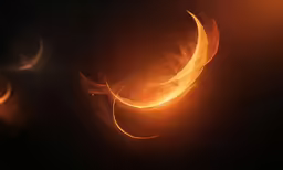 a pair of yellow spirals is in the dark