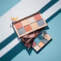 two different shades of makeup sitting on top of each other