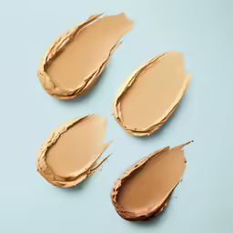 three tan colored mattes of various shapes on a blue background