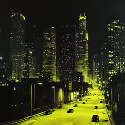 a night time picture of some tall buildings and lights
