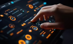 someone using an electronic device with many buttons