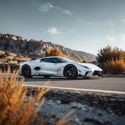 a silver sports car is shown in the desert