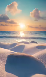 the sun is shining over the ocean with sand