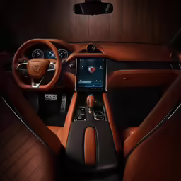 a view of a car dashboard with its illuminated tablet