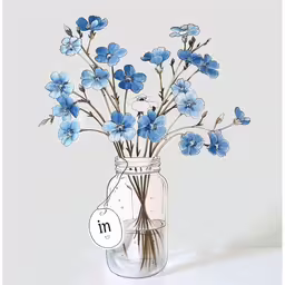a vase filled with water and blue flowers,the vase with flowers is full of tiny blue blossoms