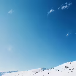 the skier is trying to gain his balance as he descends the slope