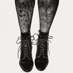 legs wearing black lacy stockings and laces