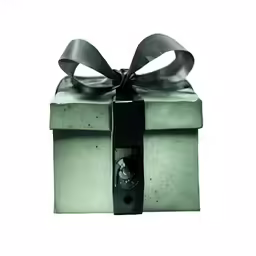 a green present box with a bow on top