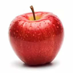 an apple with water drops all over it