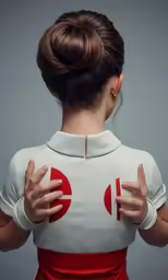 the back of a woman in white and red