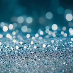 blurry image of sparkles and bubbles against blue background