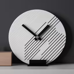a large white clock sitting on top of a table