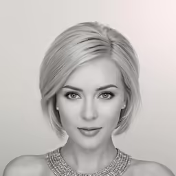 a woman wearing silver jewelry and a necklace