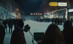 a street is crowded with people at night