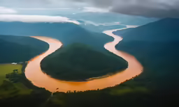 an aerial view of a river and a valley