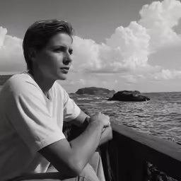 black and white photograph of man at the sea
