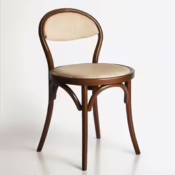 a wooden chair with a white patterned seat