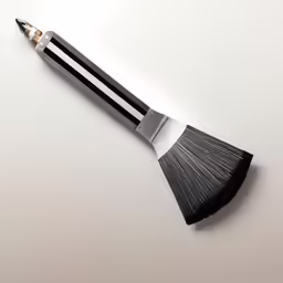 an artistic piece made from wood with black and white stripes