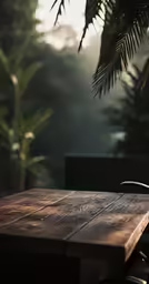 an umbrella and a wooden table in the sunlight