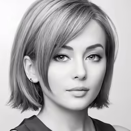 a black and white image of a woman wearing a blouse