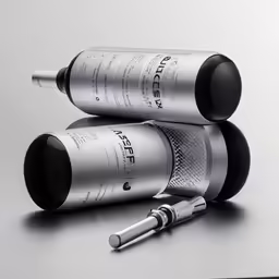 two different size silver containers next to each other